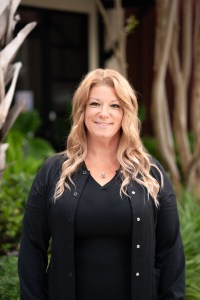 Large view of Jackie H. outside smiling.